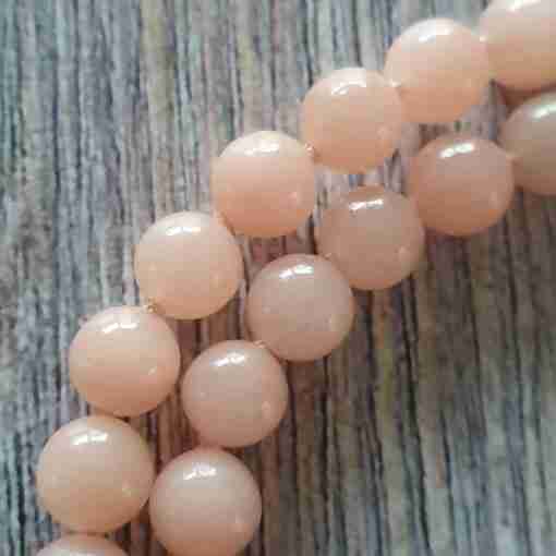Rosafarbene Aventurinquarz-Mala mit rosa-orangefarbenem Skolezit – Bild 16