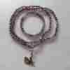 Amethystquarz ("Chevron-Amethyst") -Mala mit Edelstahlanhänger + Armband