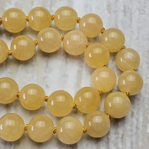 Calcit (orangefarben und gelb) -Kupfer-Mala mit gelbem Calcit-Donut – Bild 14