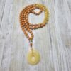 Calcit (orangefarben und gelb) -Kupfer-Mala mit gelbem Calcit-Donut