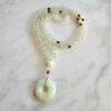 Serpentin („China Jade“) -Sandelholz (braun) -Mala mit Serpentin-Donut