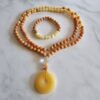 Calcit (orangefarben und gelb) -Mala mit gelbem Calcit-Donut und Armband