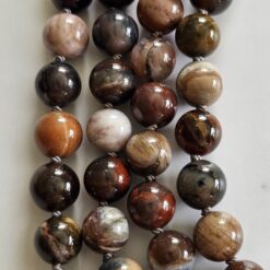 Alternative view of Versteinerte Holz-Mala (2) mit kleinerem, versteinertem Holz-Anhänger (Freiform) und Armband